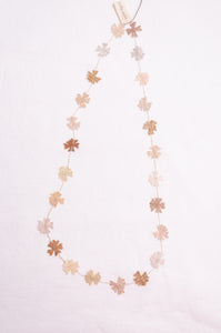 Sophie Digard fine crochet flower necklace in natural tones.