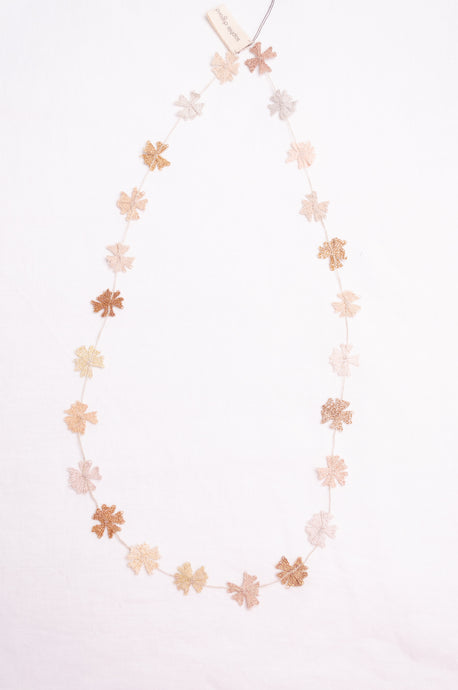 Sophie Digard fine crochet flower necklace in natural tones.