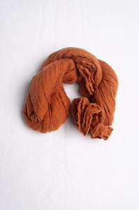 Linen gauze scarf in cinnamon brown.