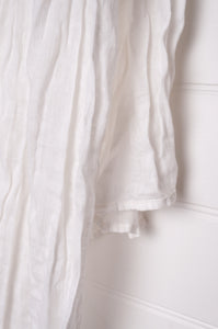 White linen gauze scarf.