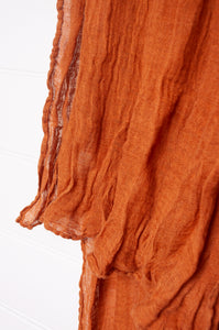 Linen gauze scarf in cinnamon brown.