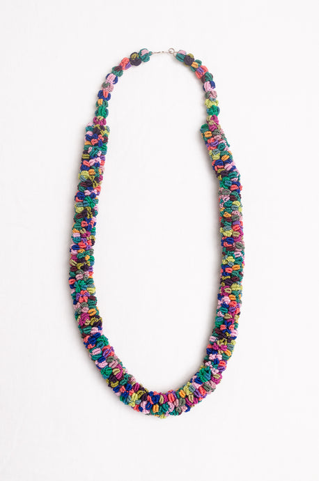 Clustered Moroccan flower button necklace in multi coloured jewel tones.