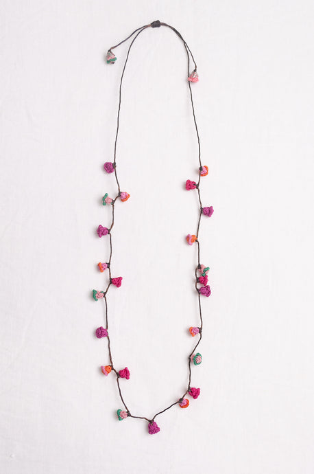 Hand made Moroccan button necklace pinks and reds with a dash of aqua.