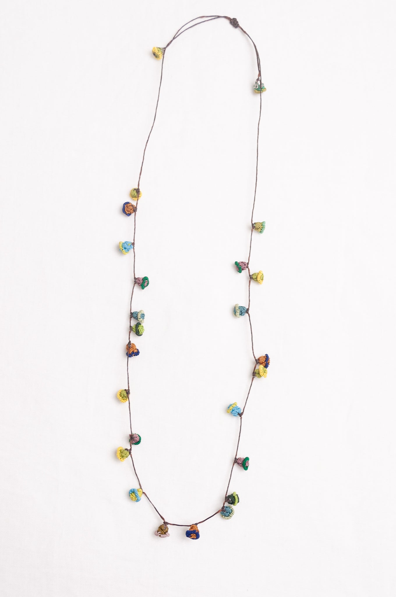 Hand made Moroccan button necklace greens yellows and aqua.