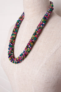 Clustered Moroccan flower button necklace in multi coloured jewel tones.