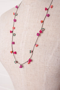 Hand made Moroccan button necklace pinks and reds with a dash of aqua.