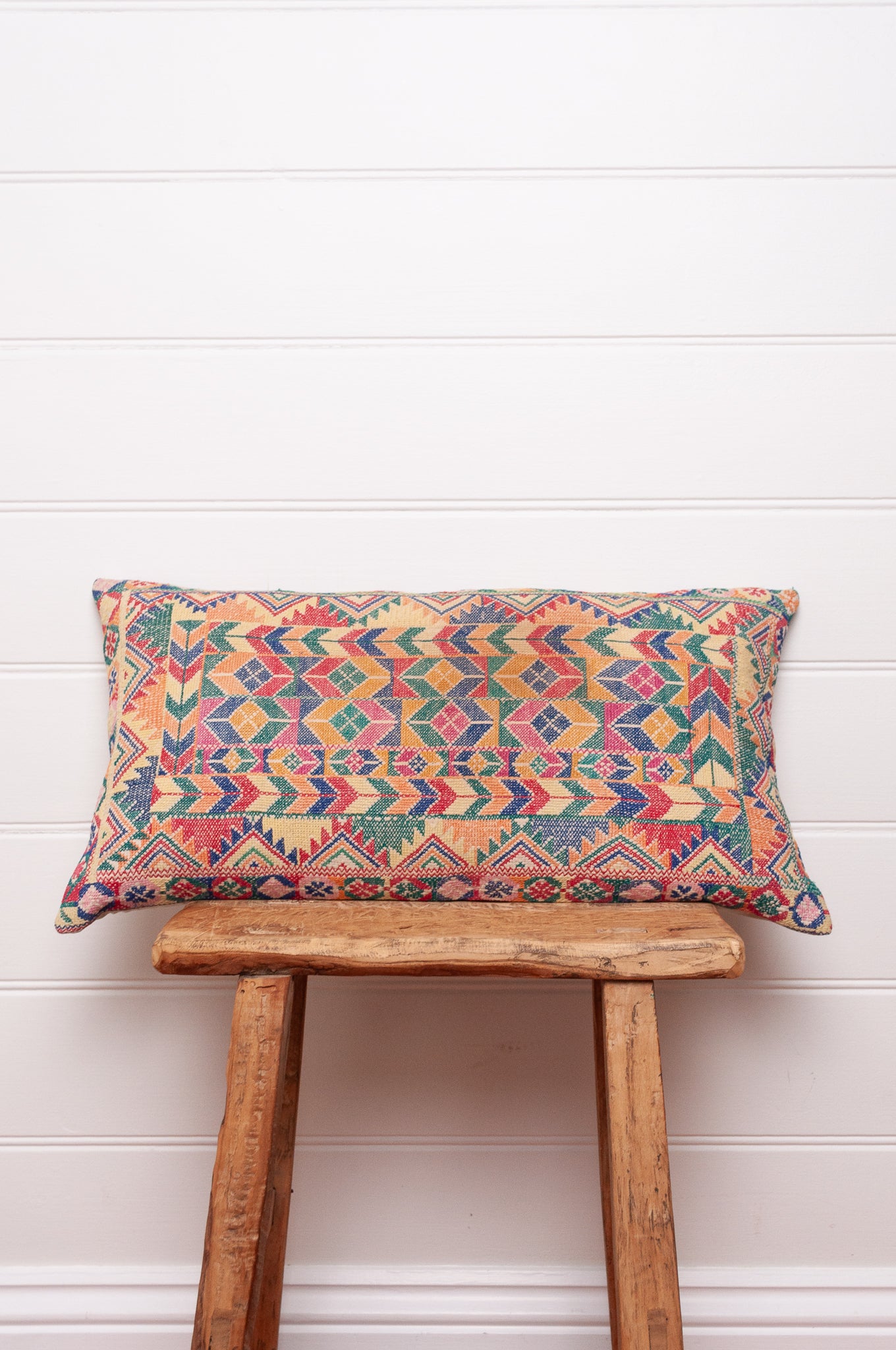 Vintage cross stitch sampler bolster cushion.