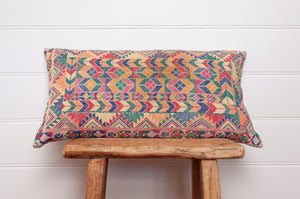 Vintage cross stitch sampler bolster cushion.