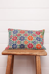 Vintage cross stitch bright floral bolster cushion.