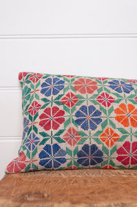 Vintage cross stitch bright floral bolster cushion.