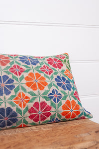 Vintage cross stitch bright floral bolster cushion.