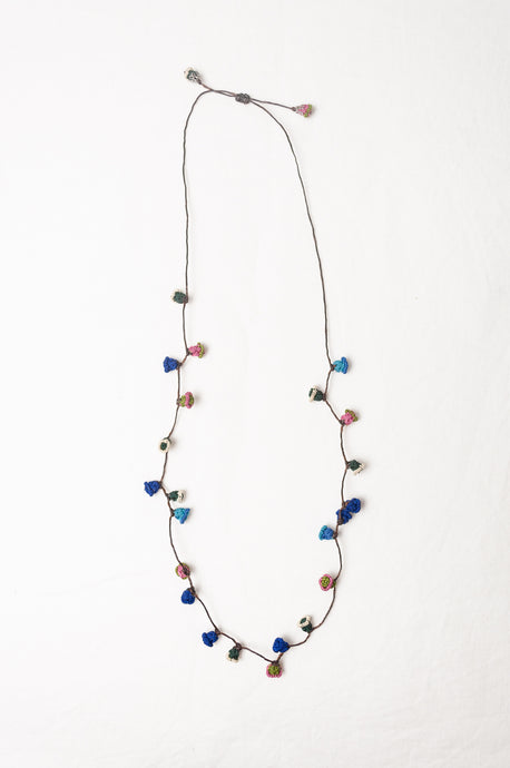 Moroccan flower button necklace in cornflower blues and pink.