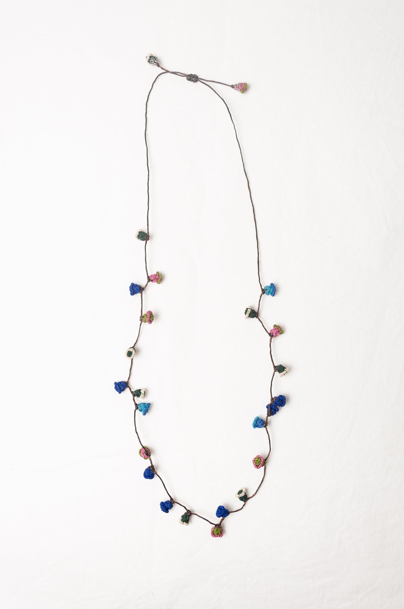 Moroccan flower button necklace in cornflower blues and pink.