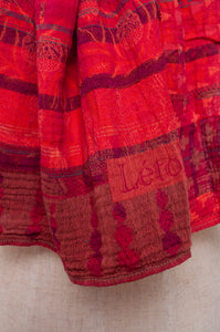 Letol organic cotton jacquard scarf in Ziggy coulis pink and red berry tones.