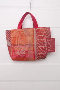 Letol mini tote bag in organic cotton made in France reversible, burnt orange floral with co-ordinating geometric print.