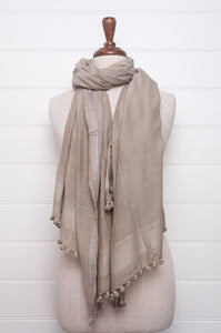 Silk and cotton scarf with pom poms in mist grey.