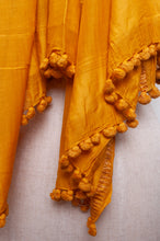 Load image into Gallery viewer, Silk and cotton scarf with pom poms in golden yellow.