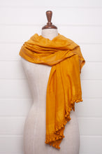 Load image into Gallery viewer, Silk and cotton scarf with pom poms in golden yellow.