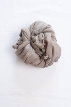 Load image into Gallery viewer, Silk and cotton scarf with pom poms in mist grey.