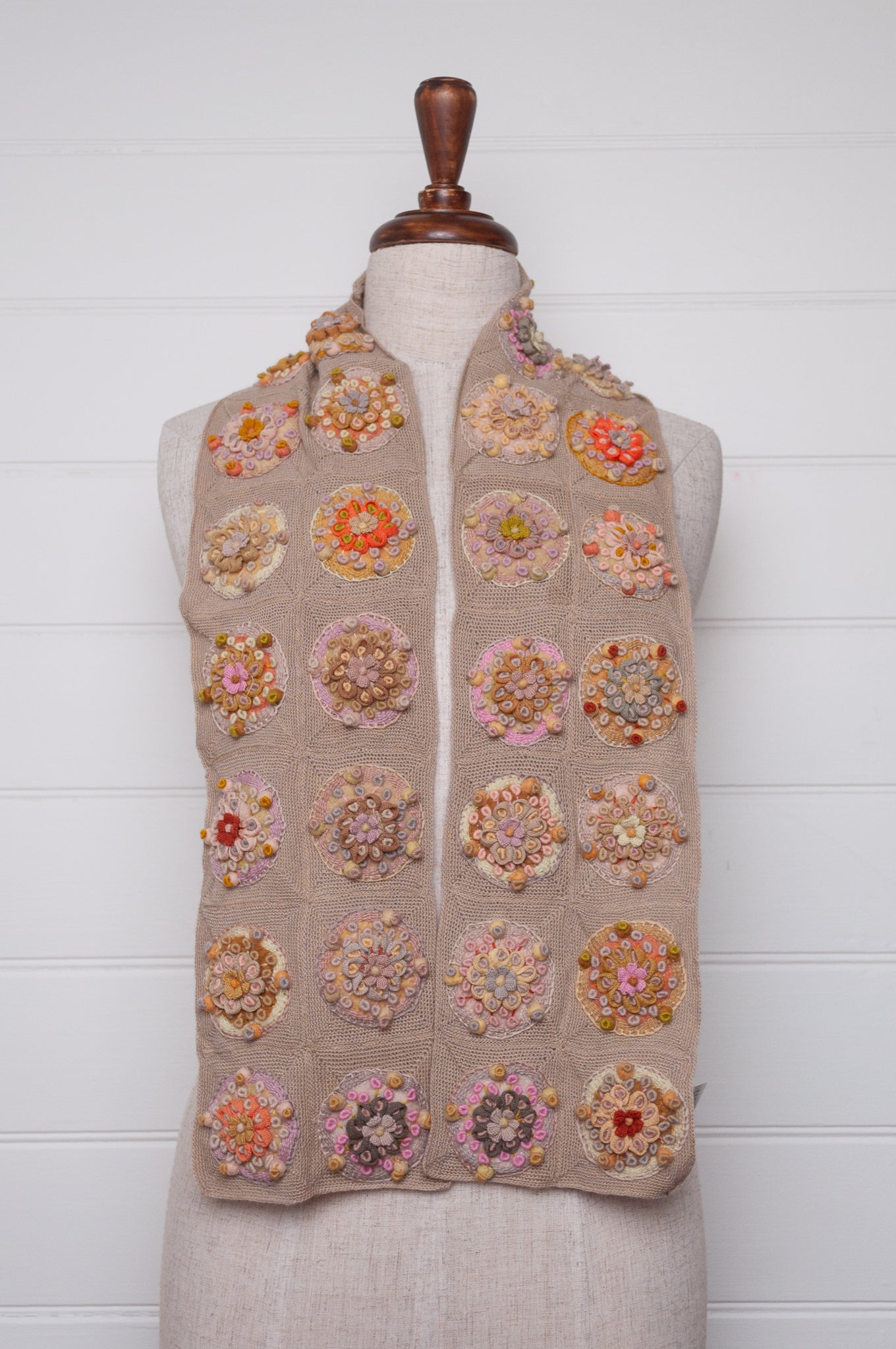 Sophie Digard crocheted scarf with embroidered and crocheted medallions in warm neutral tones.