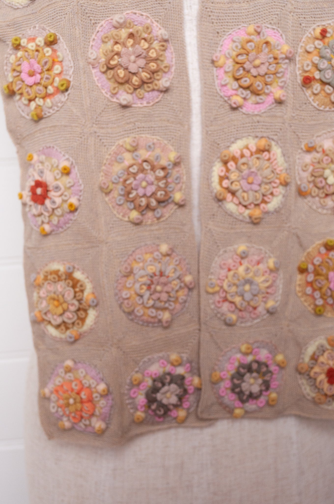 Sophie Digard crocheted scarf with embroidered and crocheted medallions in warm neutral tones.