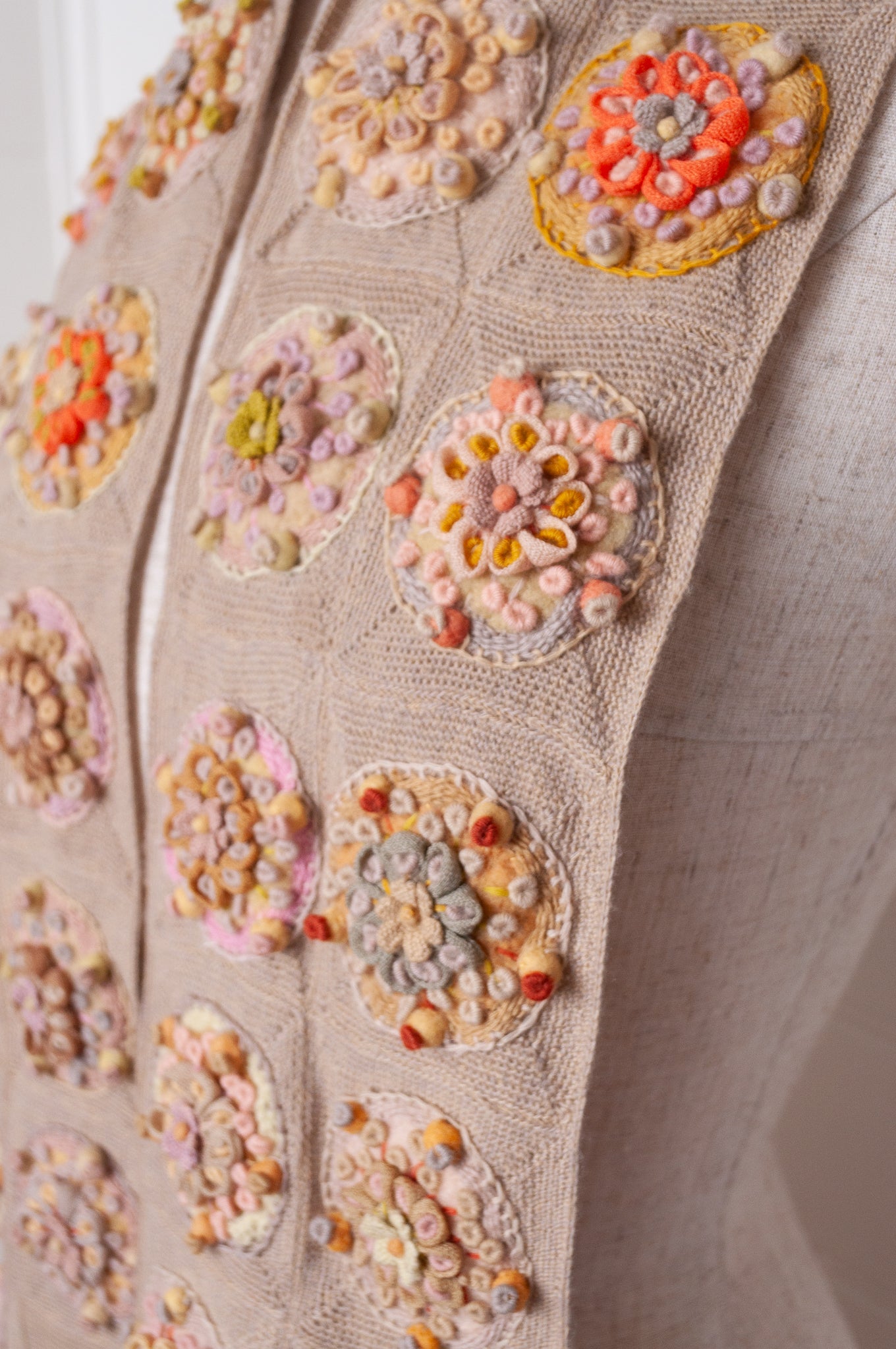Sophie Digard crocheted scarf with embroidered and crocheted medallions in warm neutral tones.