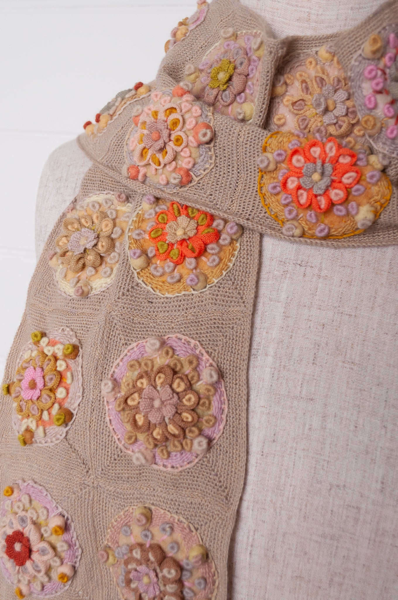 Sophie Digard crocheted scarf with embroidered and crocheted medallions in warm neutral tones.