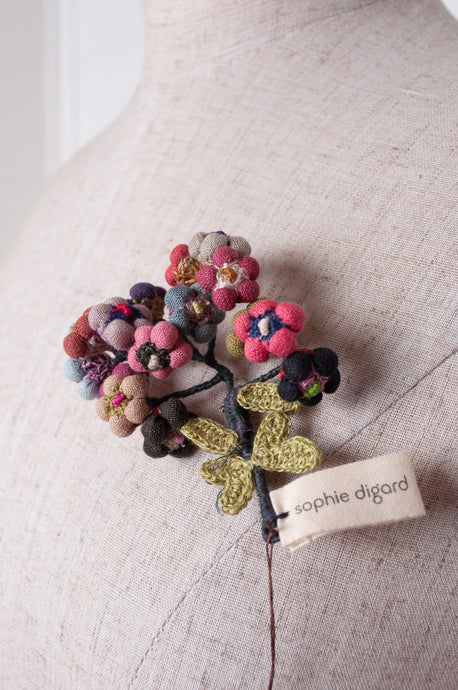 Sophie Digard colourful button flower brooch hand embroidered and crocheted in linen.