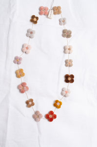 Sophie Digard classic four petal flower cotton velvet and embroidered linen necklace in warm neutrals.