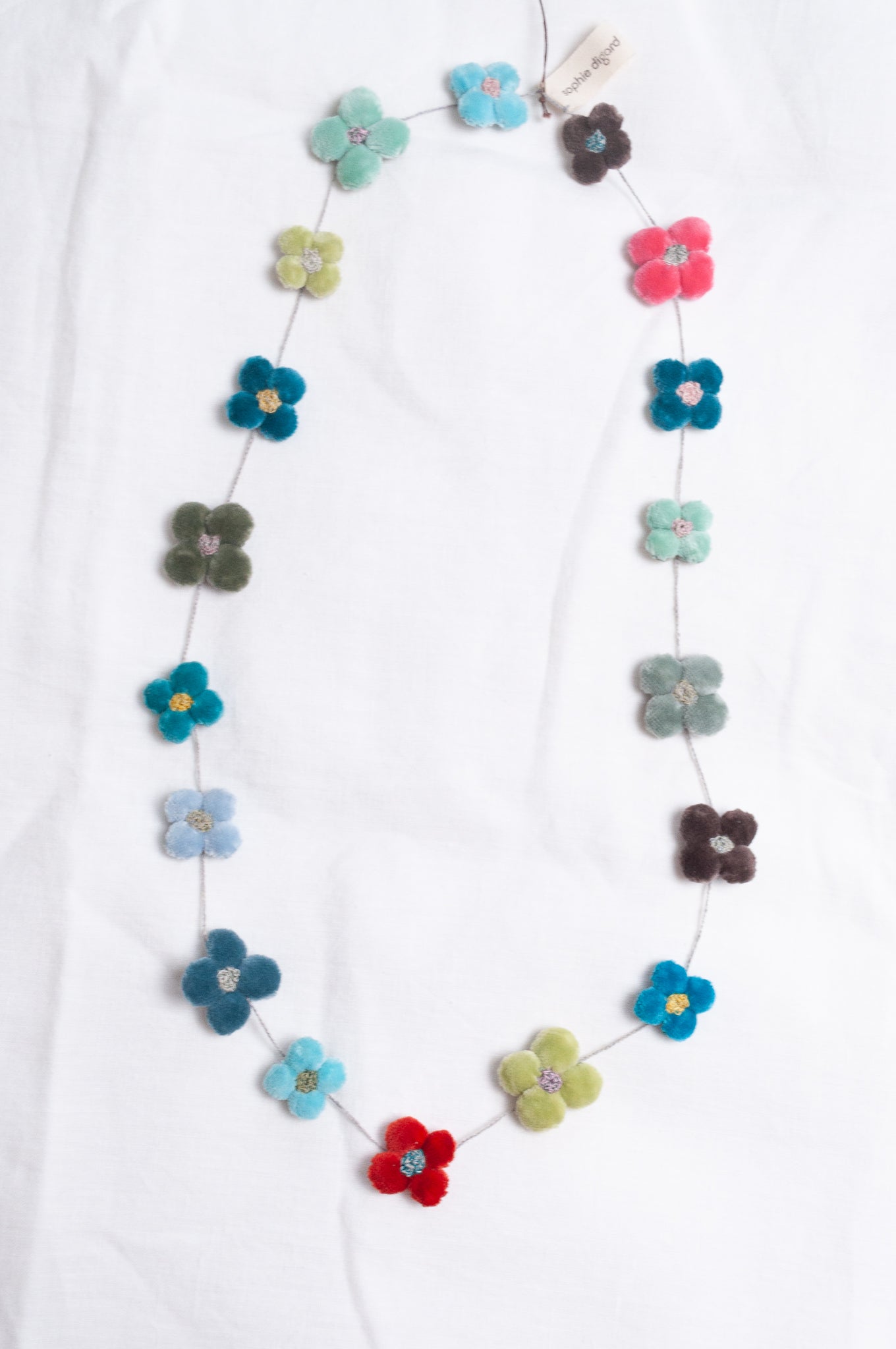 Sophie Digard classic cotton velvet four petal flower necklace in cheerful bright pastels.