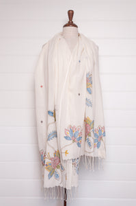 Khadi cotton hand embroidered scarf with blue and red and yellow flowers.