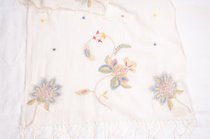 Khadi cotton hand embroidered scarf with blue and red and yellow flowers.