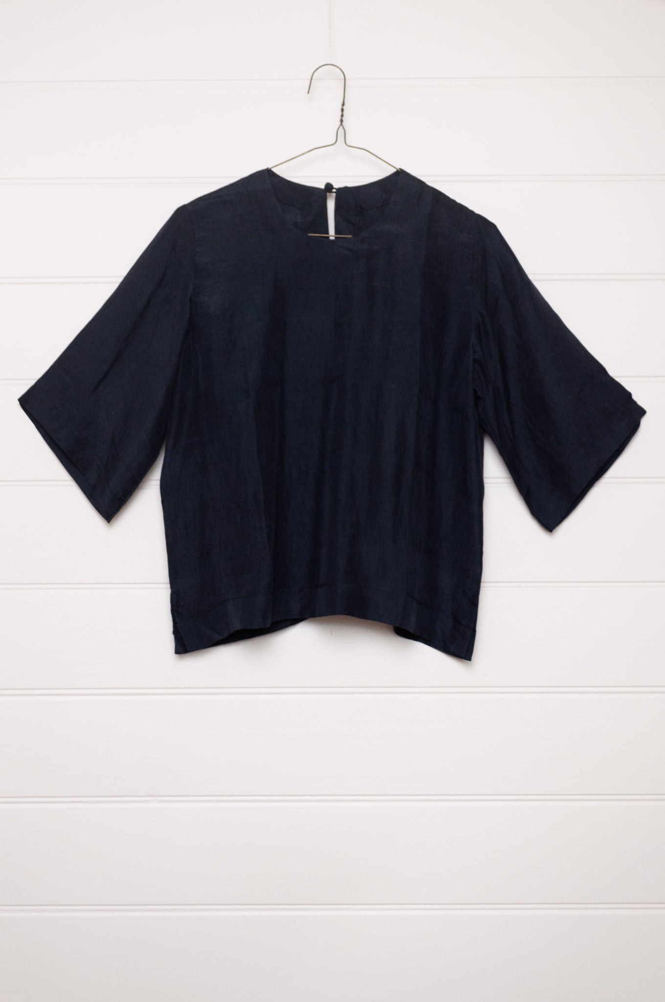 Handloom silk box top with mid length sleeves in ebony black.
