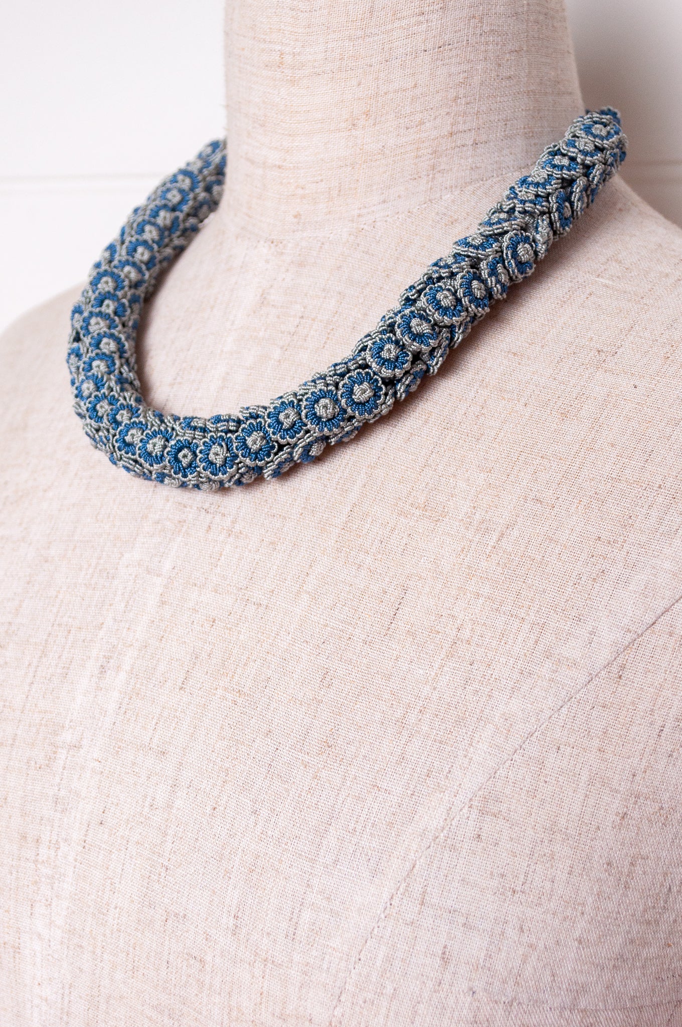 Moroccan button Latifa necklace in denim blue and silver grey button flowers.