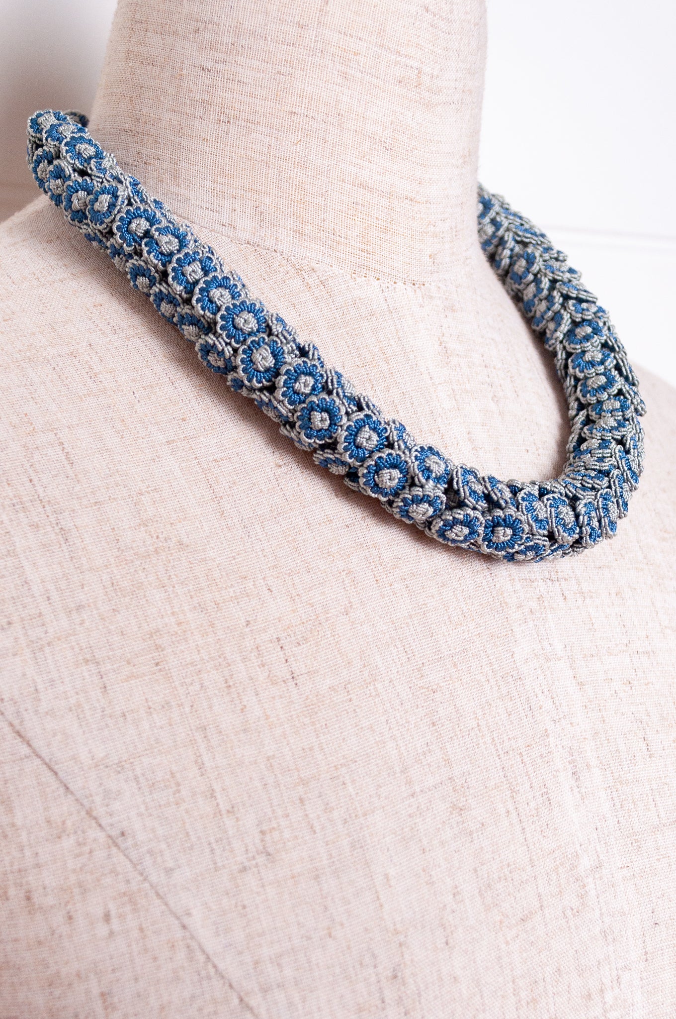 Moroccan button Latifa necklace in denim blue and silver grey button flowers.