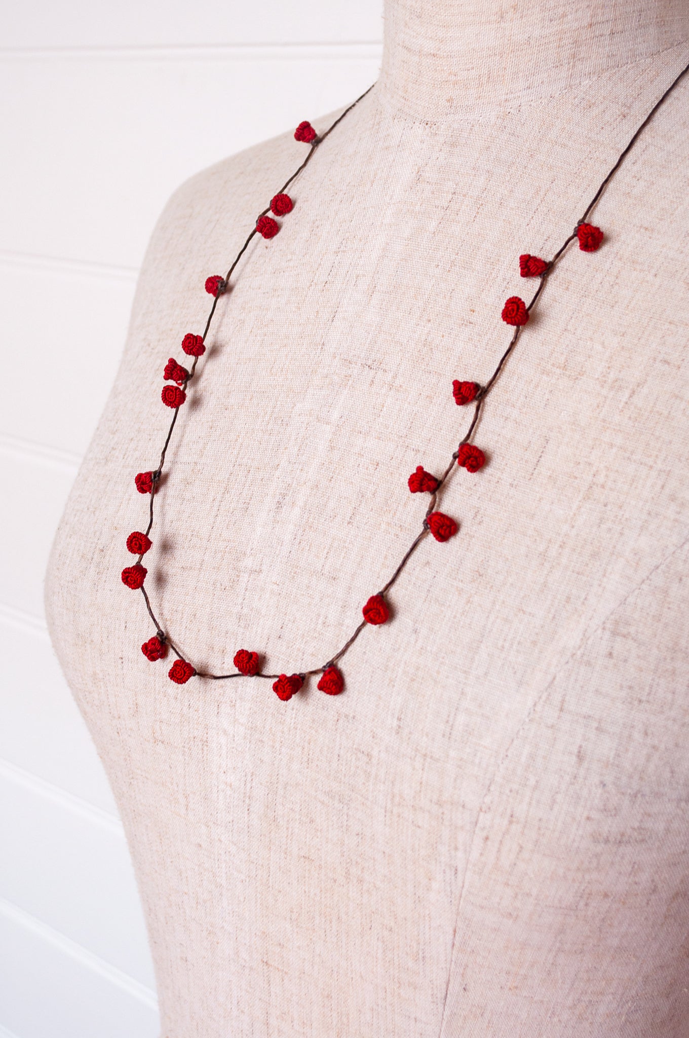 Handmade Moroccan button necklace in  rose red.