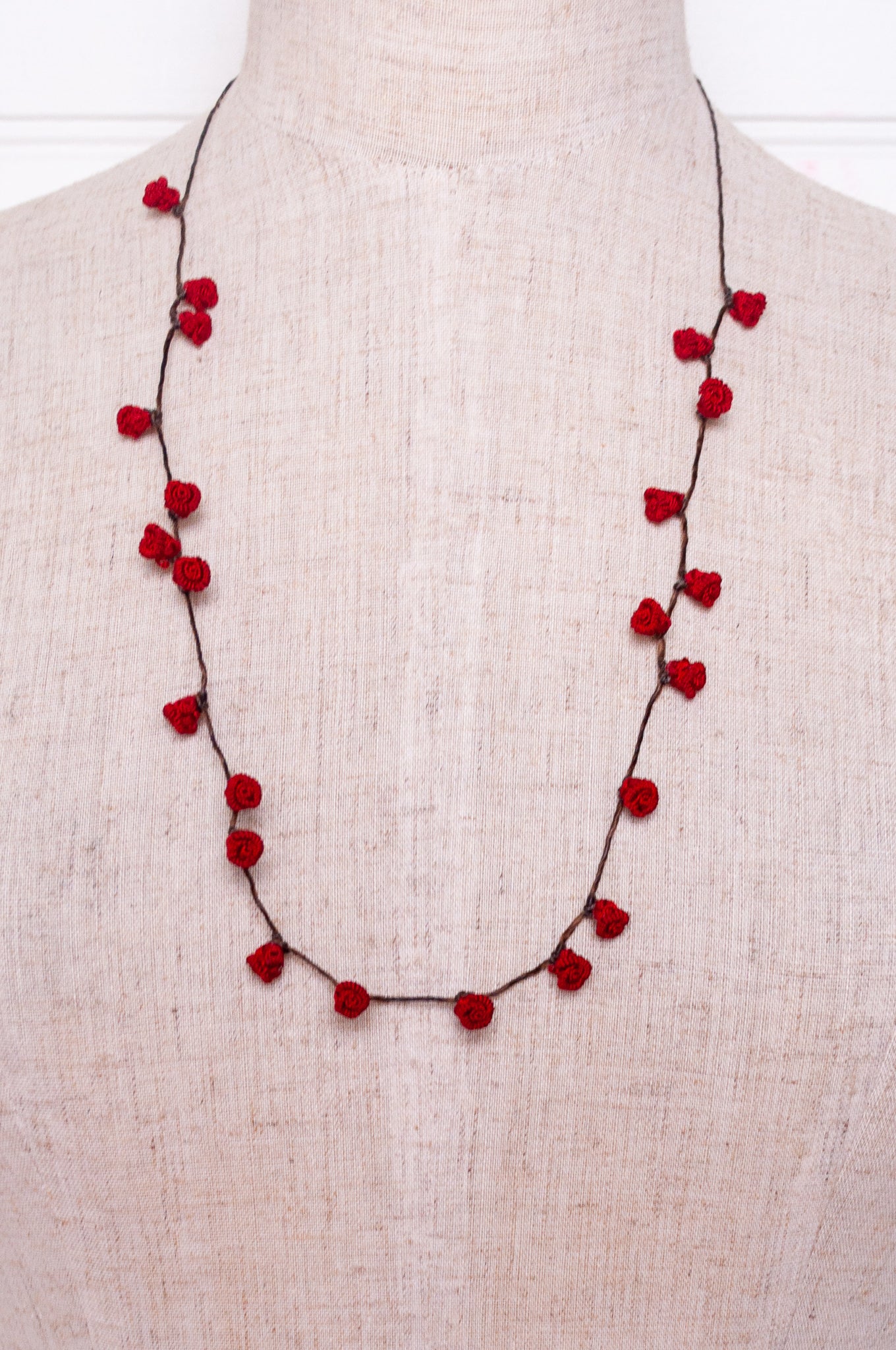 Handmade Moroccan button necklace in  rose red.