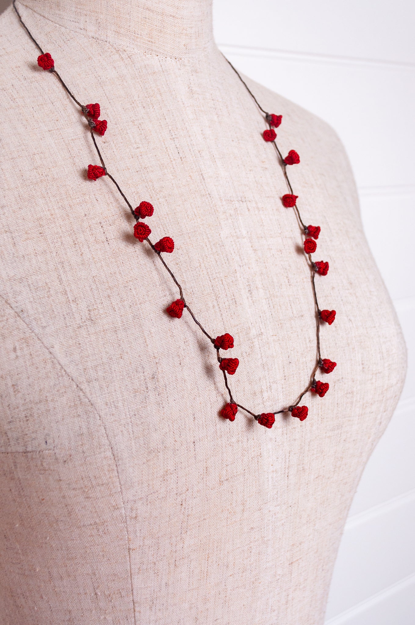 Handmade Moroccan button necklace in  rose red.