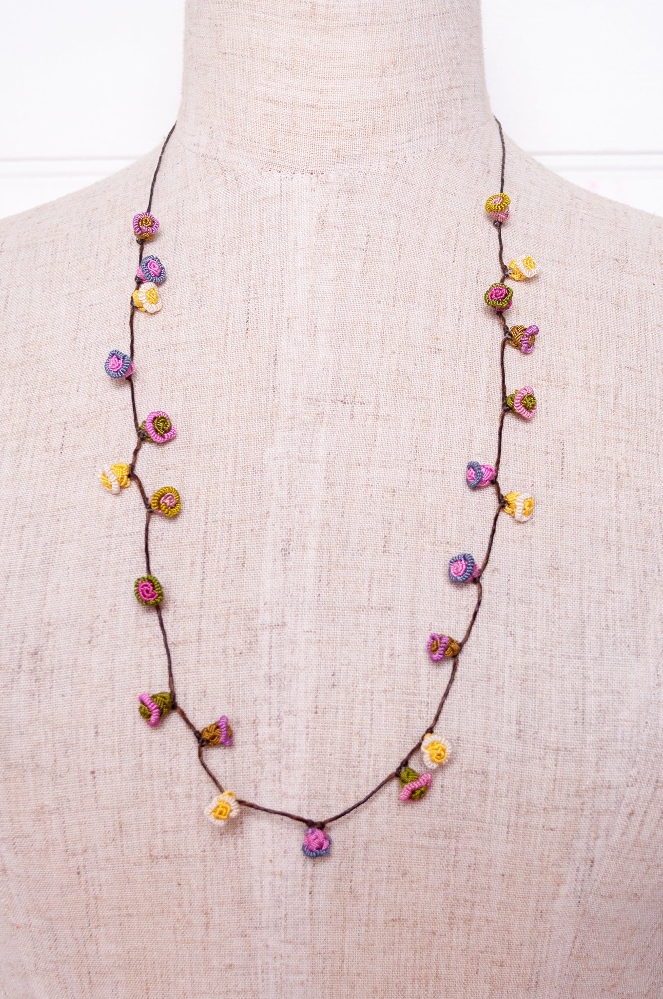 Handmade Moroccan button necklace in  soft pink, lemon and olive.