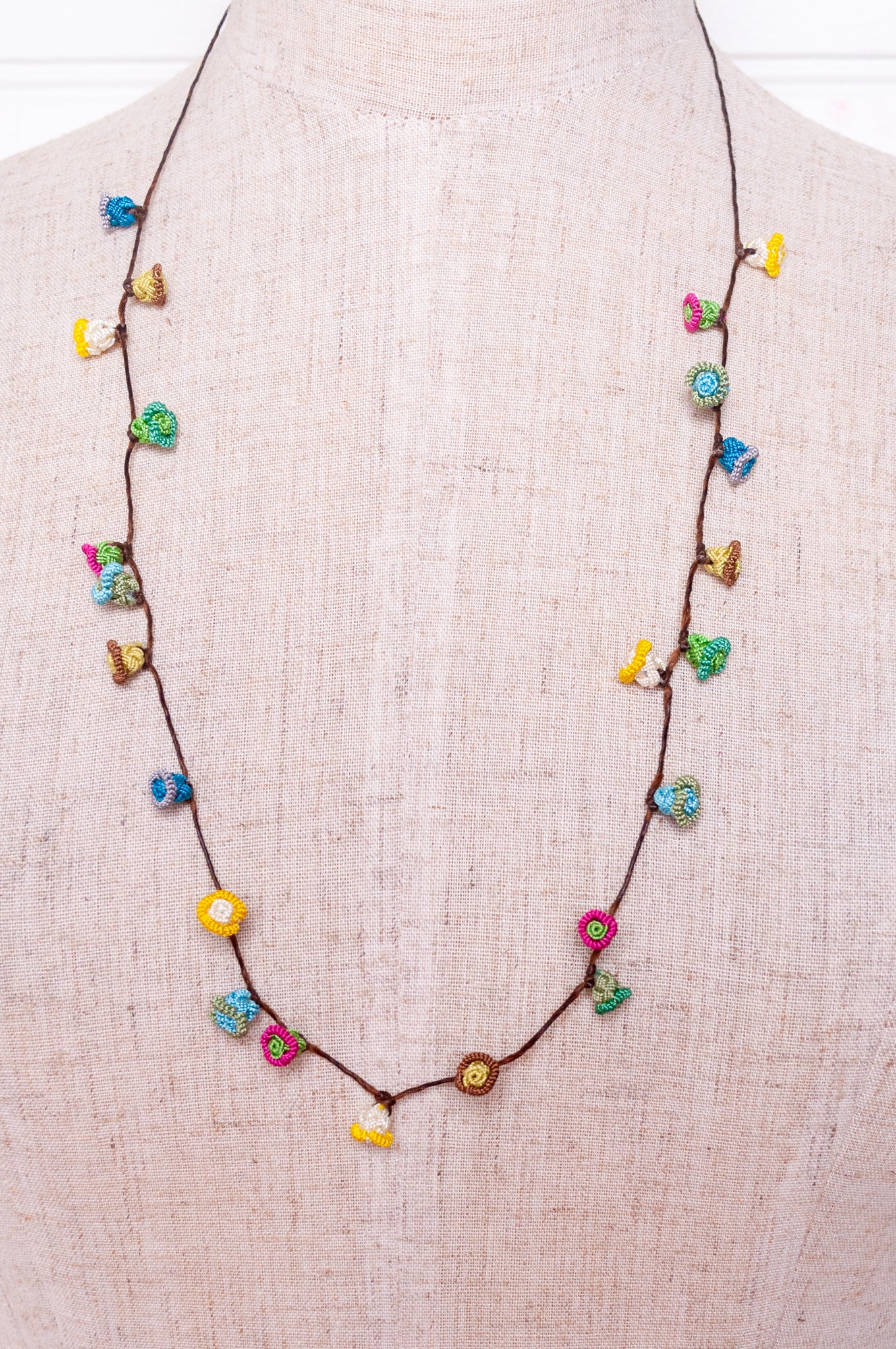Handmade Moroccan button necklace in  soft pastels.