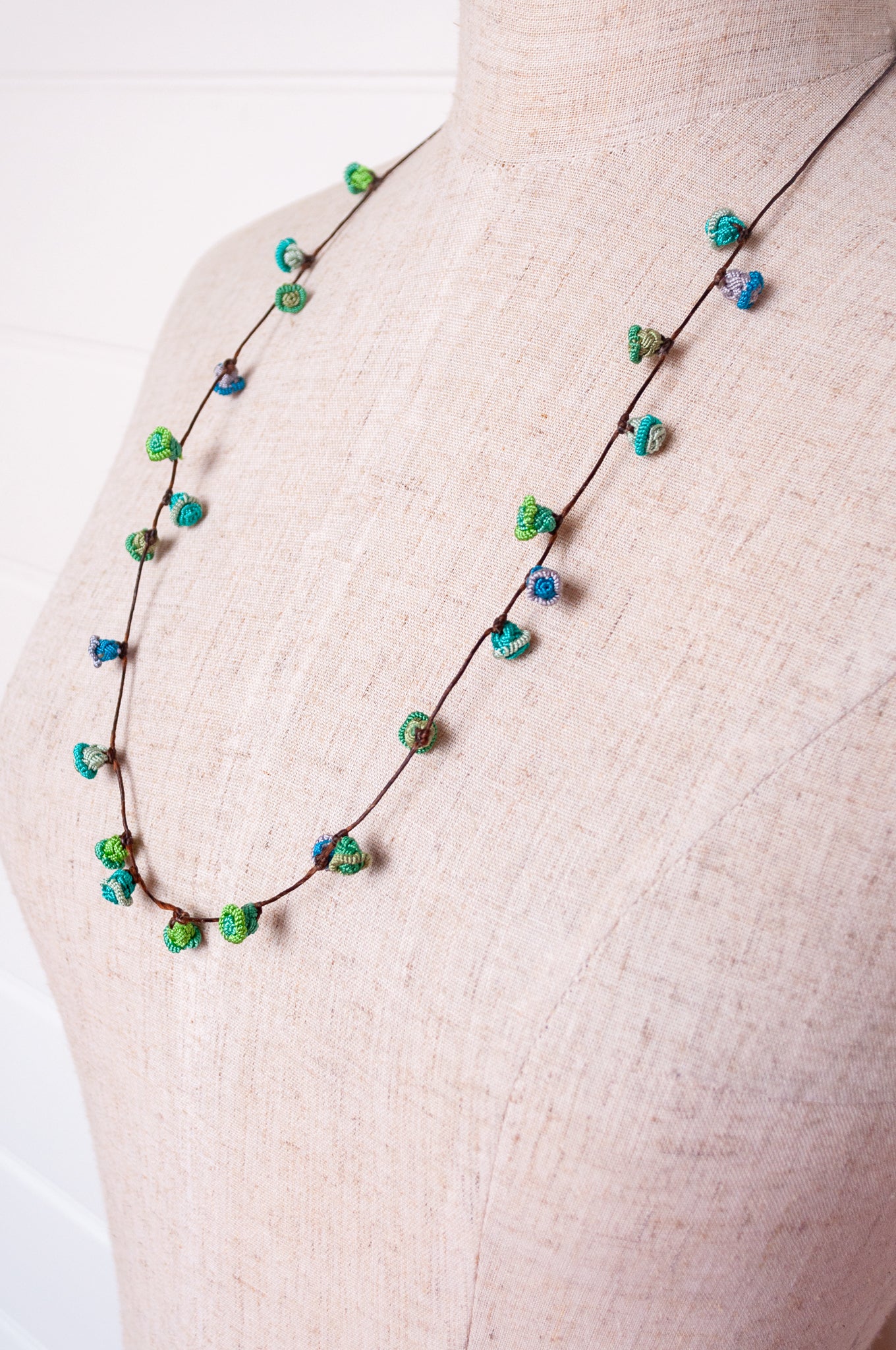 Handmade Moroccan button necklace in  blues and greens.