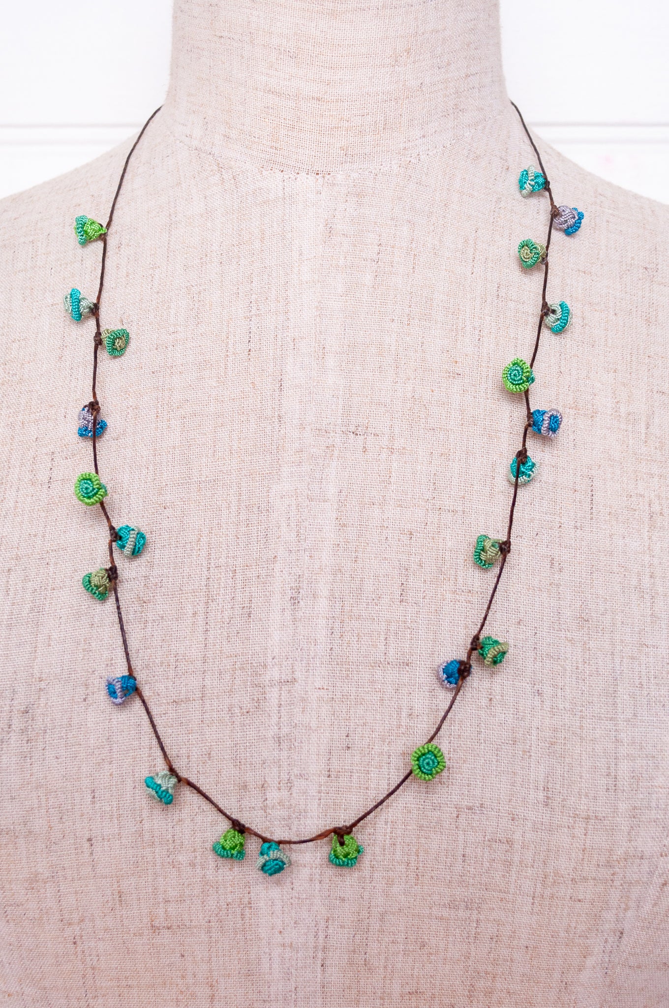 Handmade Moroccan button necklace in  blues and greens.