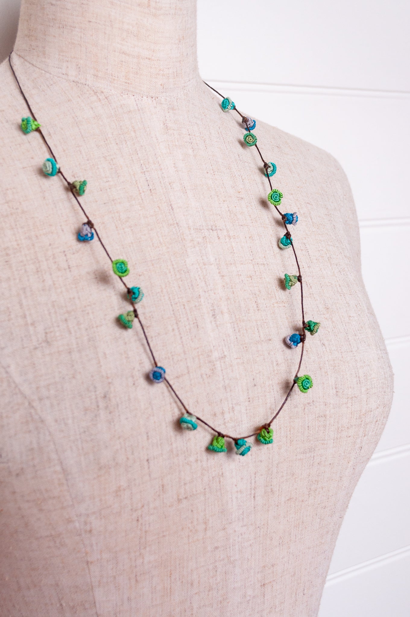 Handmade Moroccan button necklace in  blues and greens.
