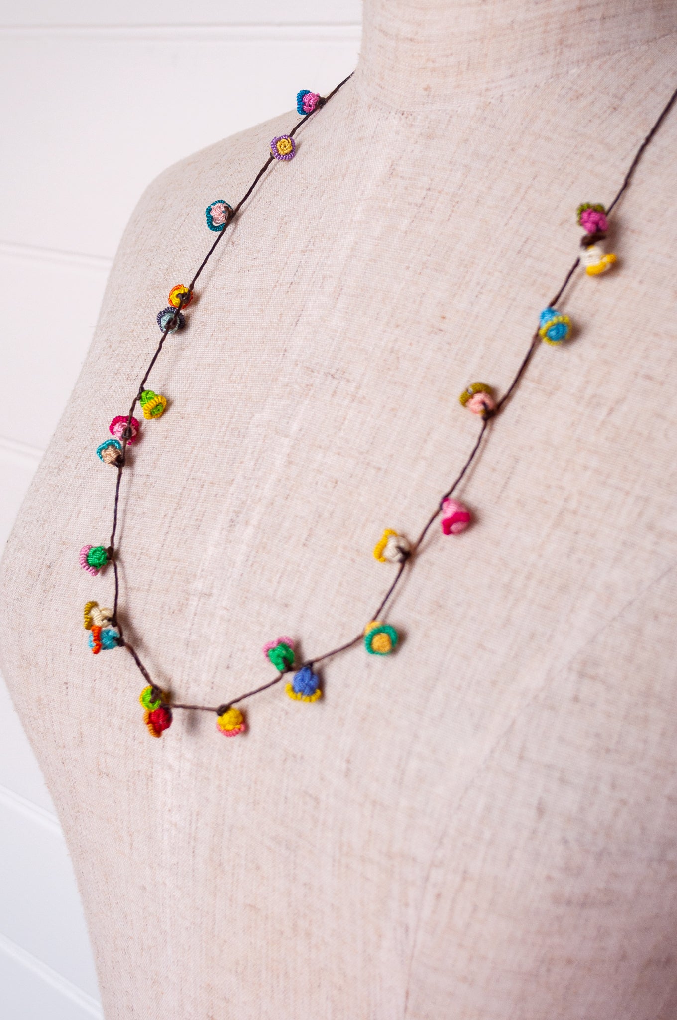 Handmade Moroccan button necklace in  bright pastels.