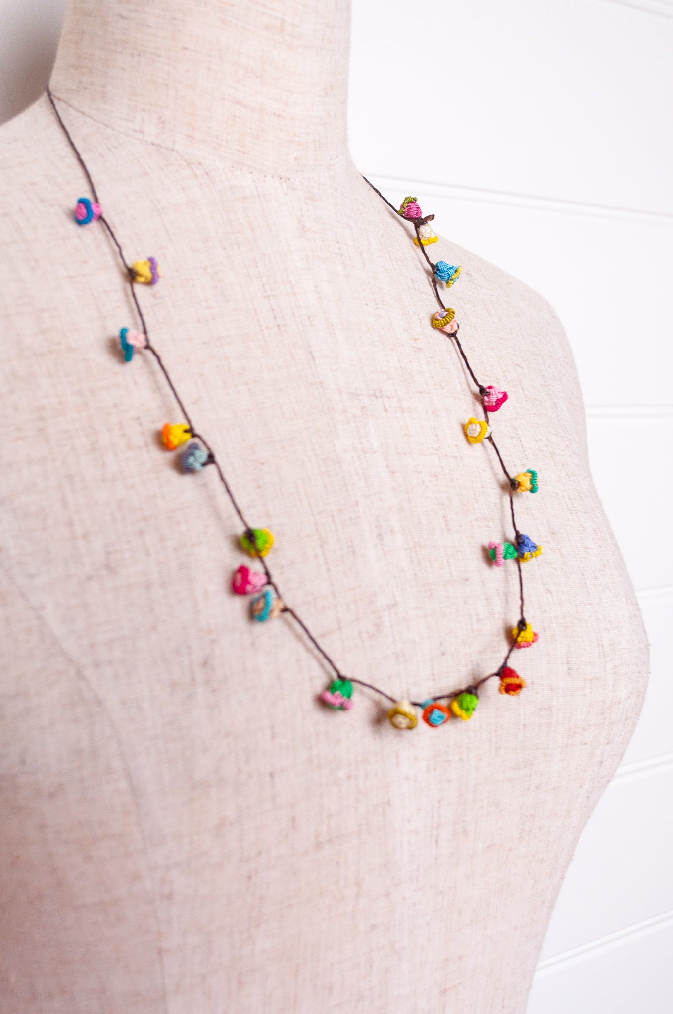 Handmade Moroccan button necklace in  bright pastels.