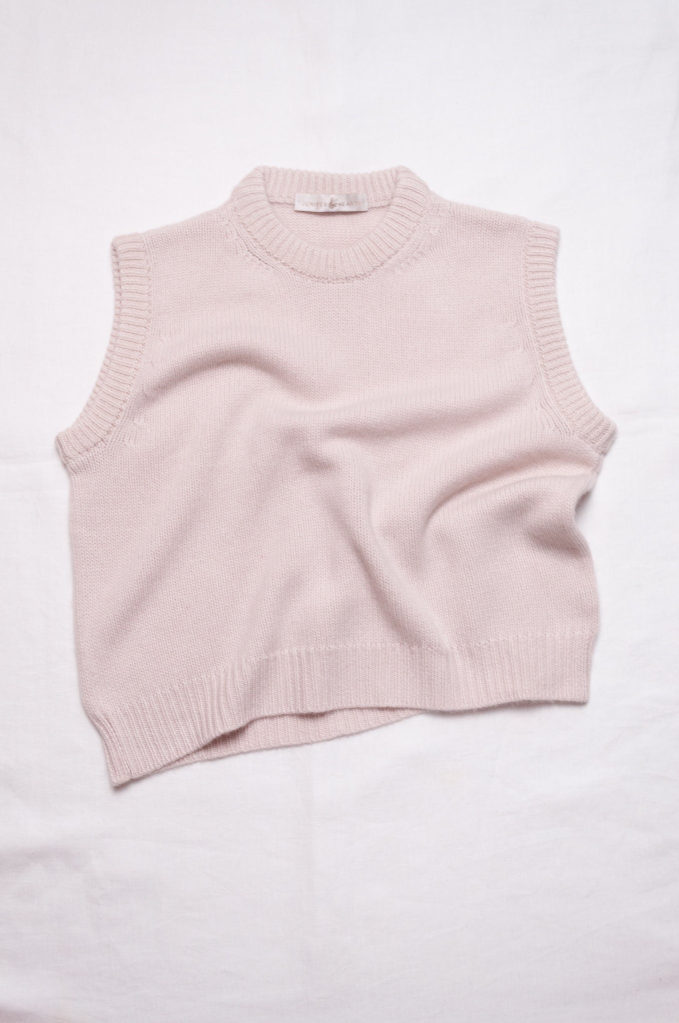 Juniper Hearth cashmere vest in ecru cream.