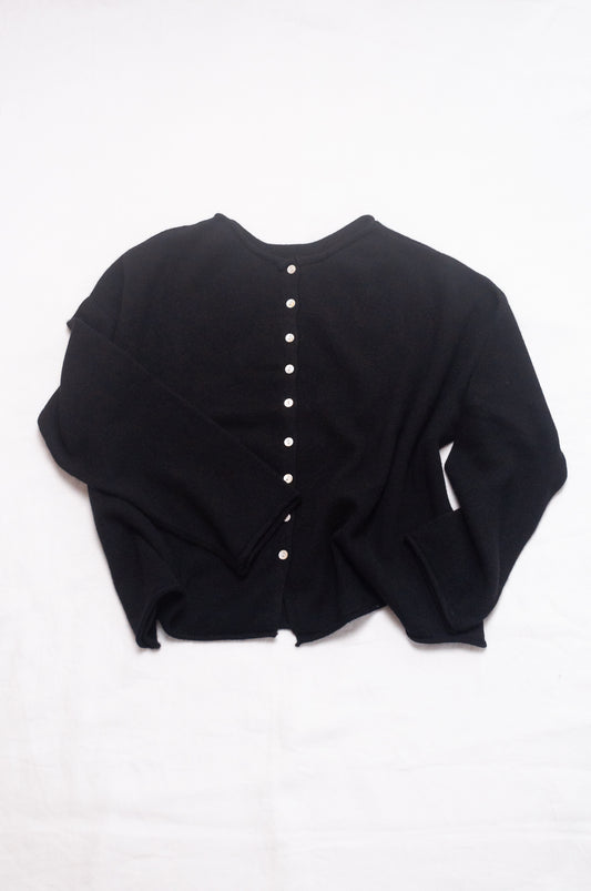 One size reversible cashmere cardigan in black.