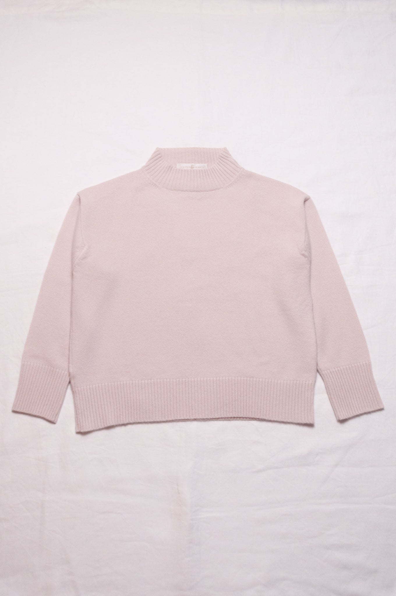 Juniper Hearth high neck turtleneck cashmere sweater in ecru cream.
