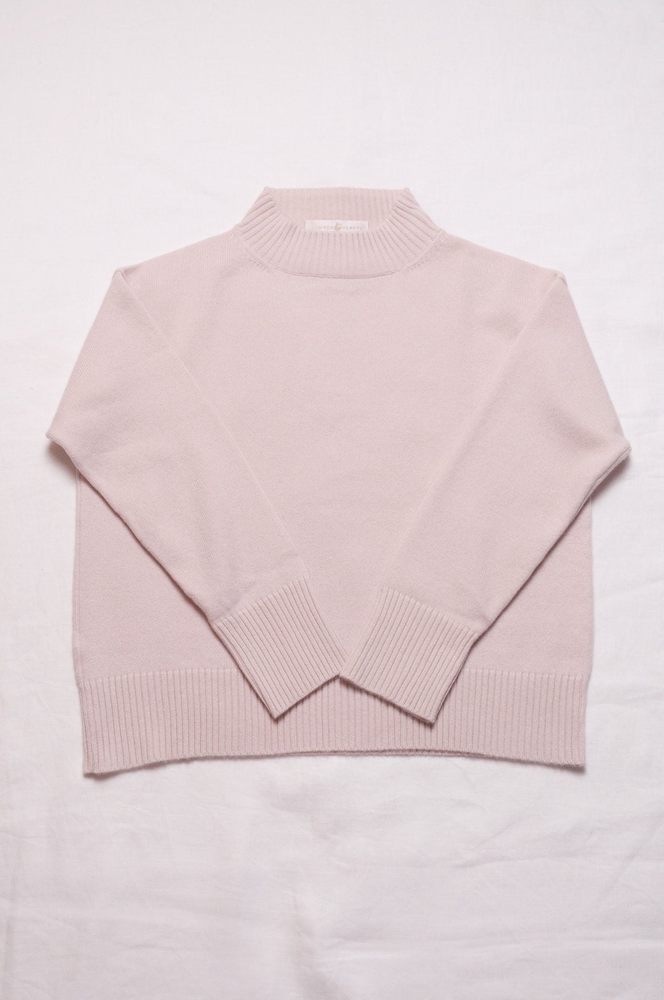 Juniper Hearth high neck turtleneck cashmere sweater in ecru cream.