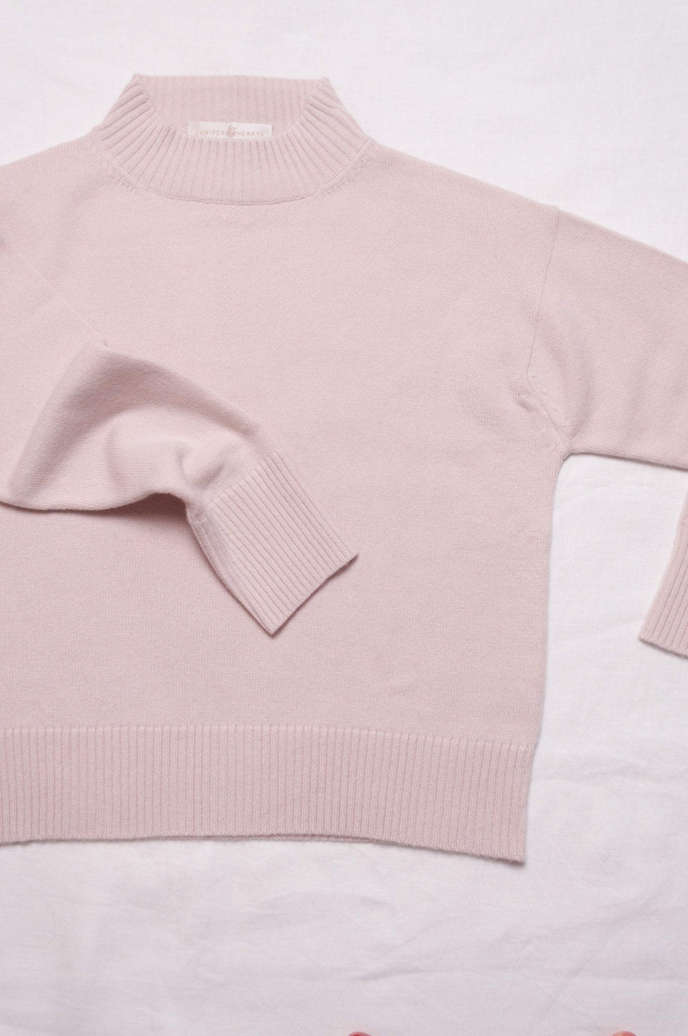 Juniper Hearth high neck turtleneck cashmere sweater in ecru cream.